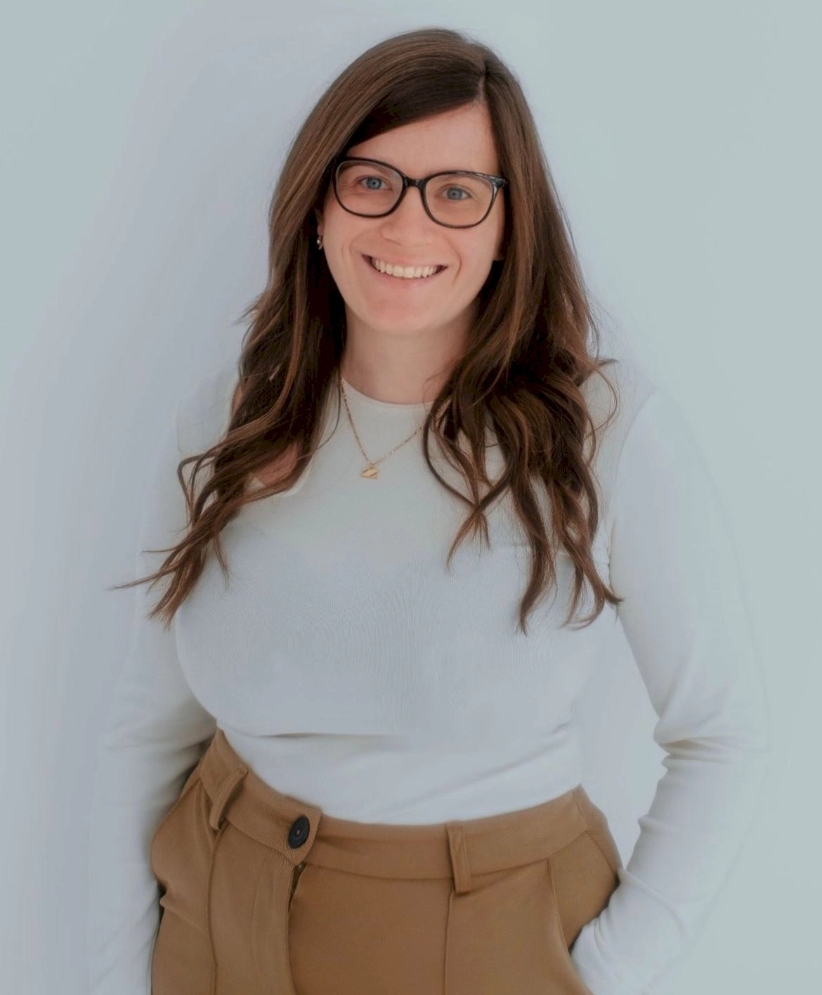 picture of Zoe Ashbridge standing with her hands in her pockets.
